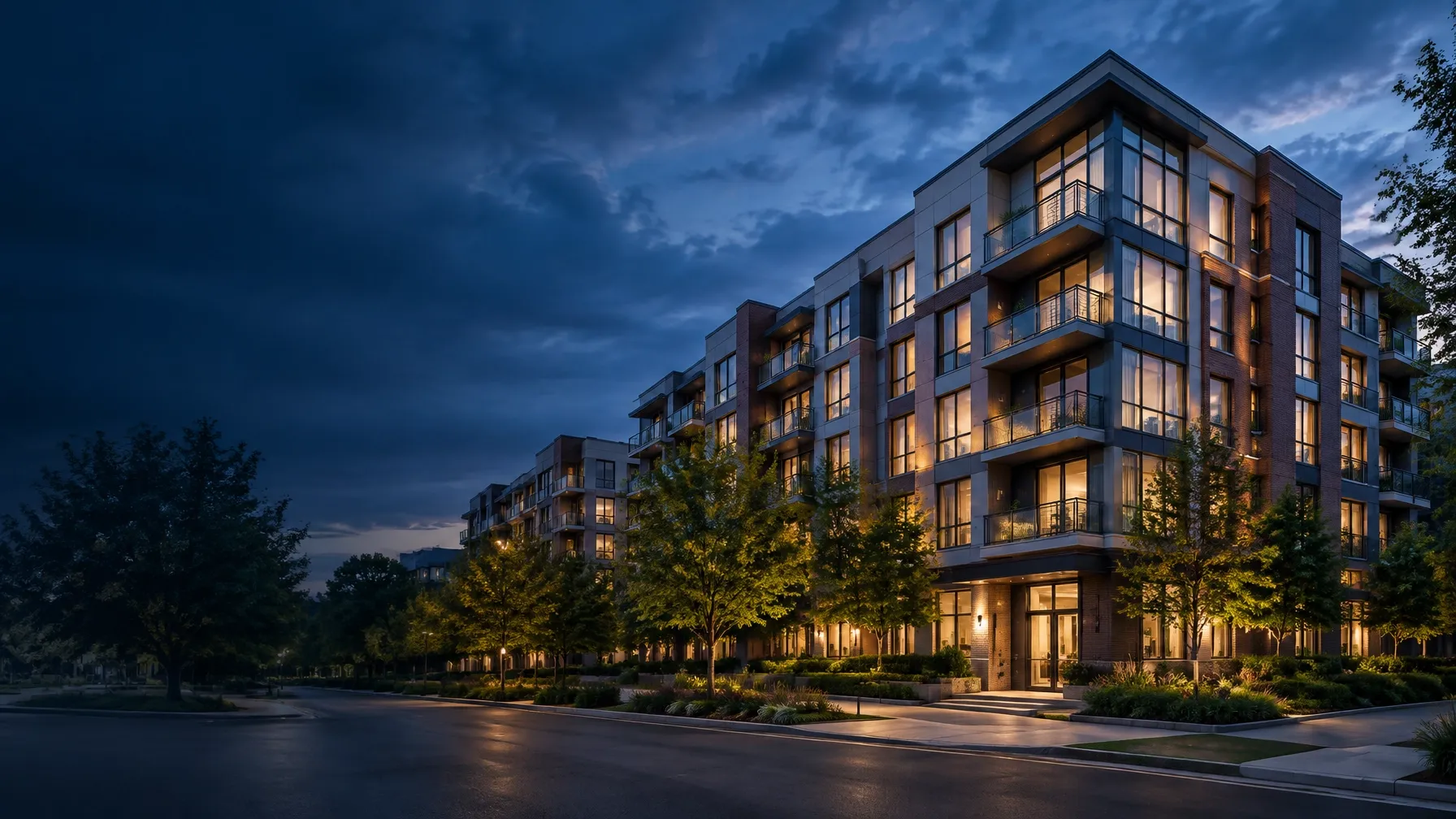 Institutional-scale multifamily apartment community at dusk